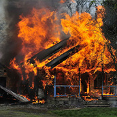 Wildfire burning house