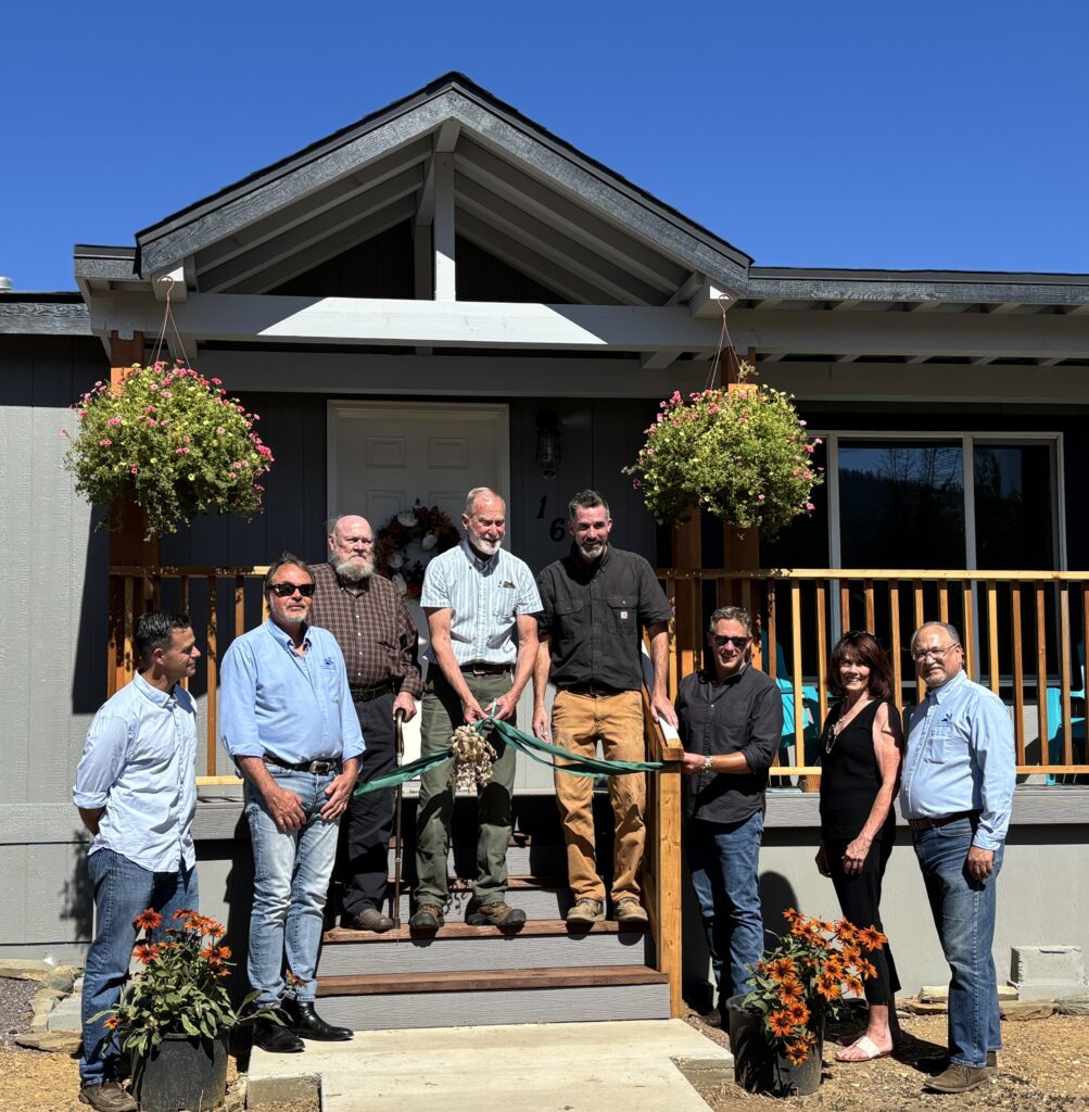 Ribbon cutting group photo for Welcome Home Greenville
